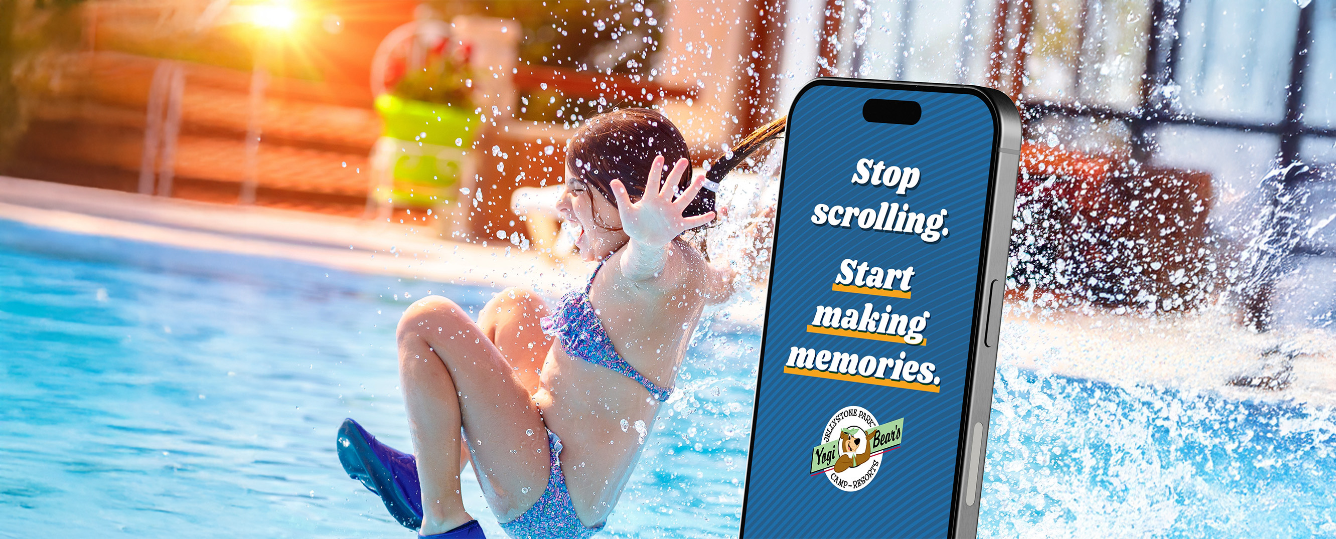 Jellystone Park advertisment on a phone with girl splashing into a pool in the background